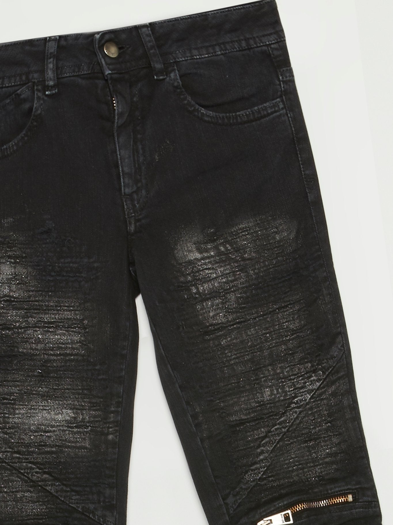 Черные джинсы с молниями на коленях