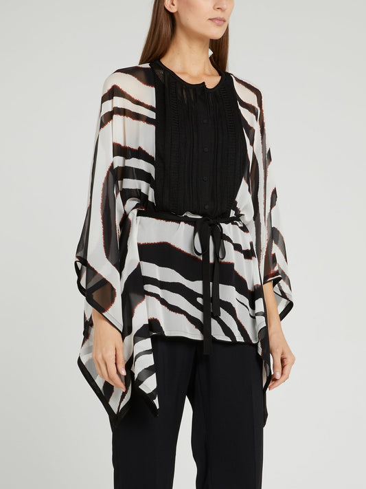 Блузка с анималистическим принтом и перфорацией