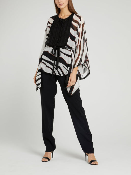 Блузка с анималистическим принтом и перфорацией