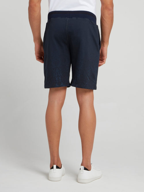 Темно-синие шорты с выцветшим эффектом и змеиным принтом