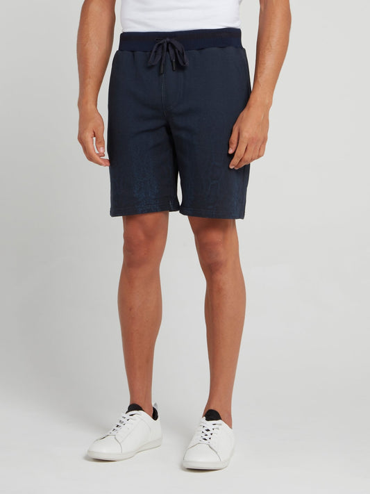 Темно-синие шорты с выцветшим эффектом и змеиным принтом