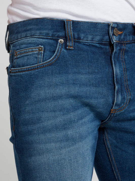 Синие джинсы с изображением змеи