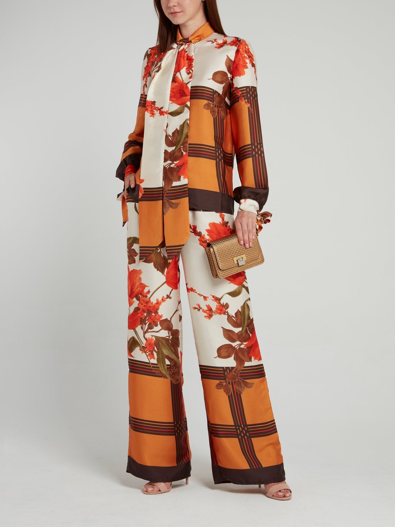 Оранжевые широкие брюки с цветочным принтом