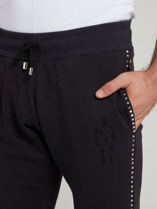 Темно-синие спортивные брюки с рваной отделкой