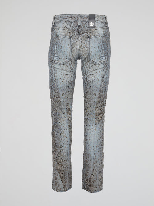 Unleash your wild side with the Roberto Cavalli Snake Print Denim Jeans, a bold and daring addition to your wardrobe that will turn heads wherever you go. Crafted from high-quality denim, these jeans feature a sleek snake print design that adds a touch of edgy sophistication to any outfit. Embrace your inner fashionista and elevate your style with these statement-making jeans that are sure to make you stand out from the crowd.