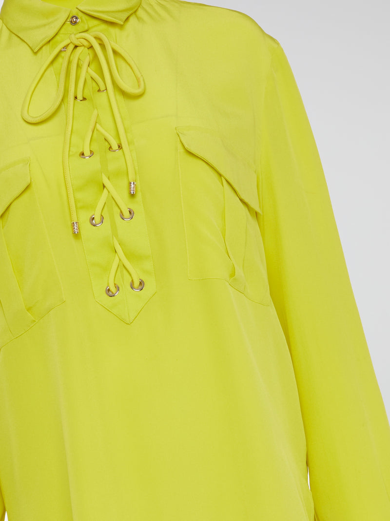 Embrace your inner rockstar with the Neon Lace Up Blouse by Roberto Cavalli, the perfect combination of edgy and sophisticated. With its bold neon color and sexy lace-up detailing, this top is sure to turn heads wherever you go. Pair it with your favorite leather pants for a look that screams fierce and fabulous.