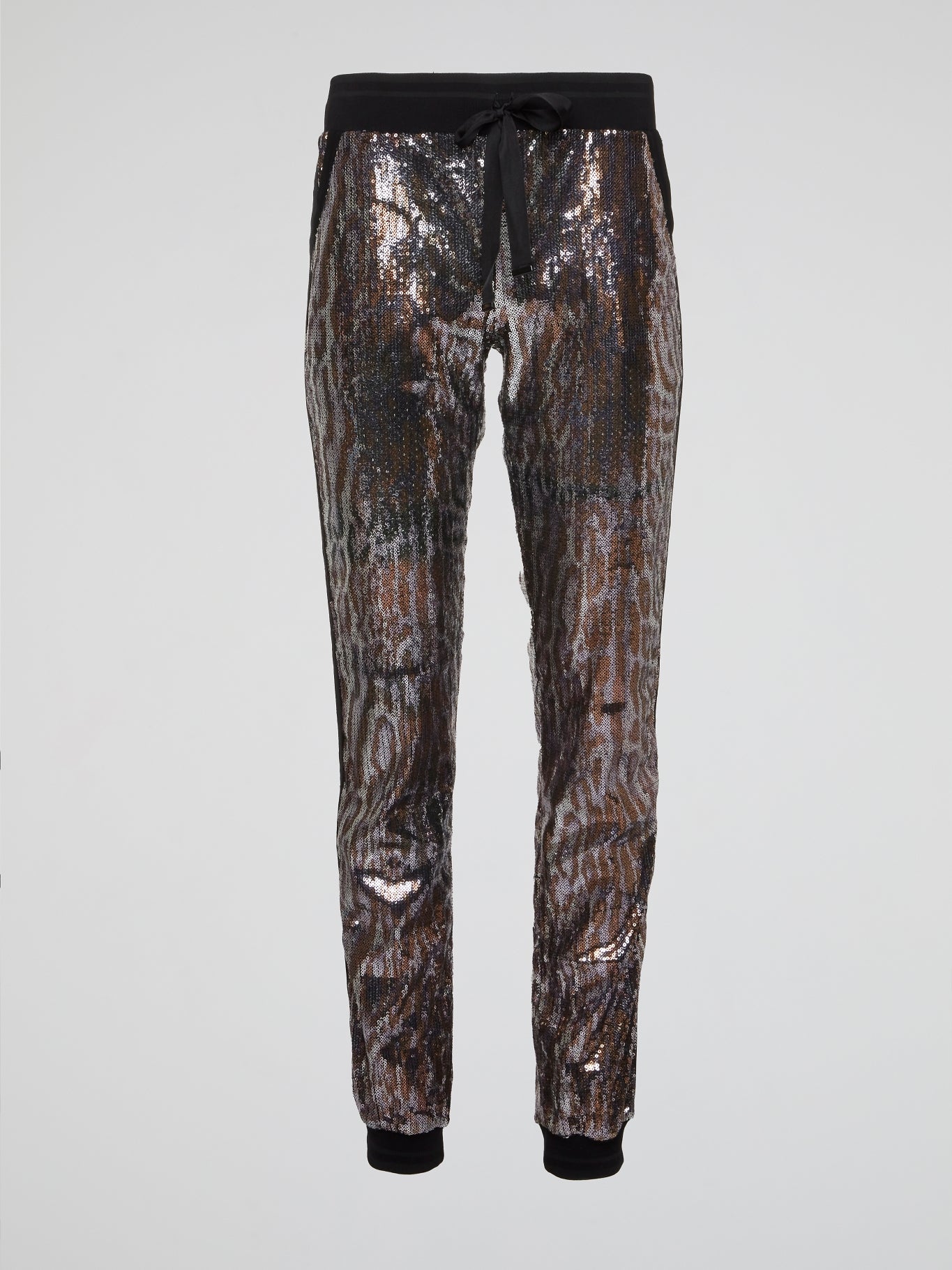 Feel fierce and fabulous in our Leopard Pattern Sequin Pants from Roberto Cavalli. These statement-making bottoms are sure to turn heads wherever you go, with their bold leopard print and shimmering sequins. Channel your inner wild side and stand out from the crowd in these show-stopping pants.