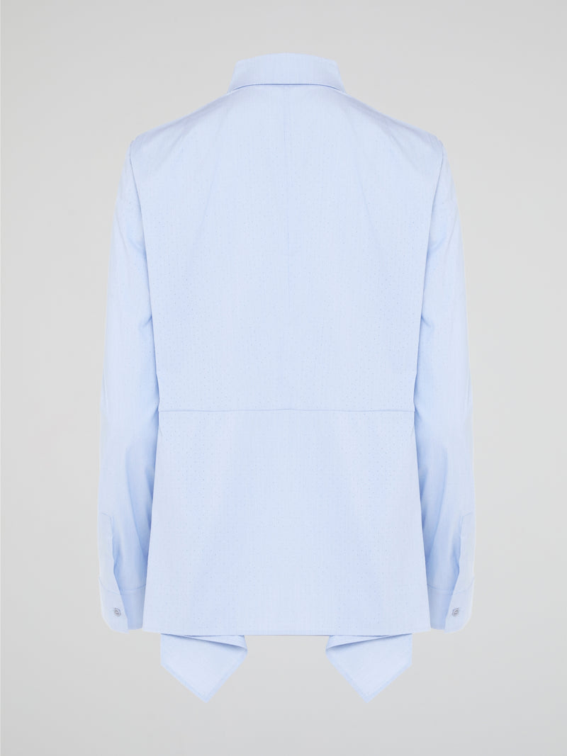 Introducing the Powder Blue High-Low Shirt by Akris Punto, where elegance meets contemporary style. Delicate powder blue hue cascades down the front, enveloping you in a calming wave of tranquility. With its unique high-low hemline and luxurious fabric, this shirt effortlessly elevates any outfit, making it a must-have piece for the fashion-forward trendsetters.