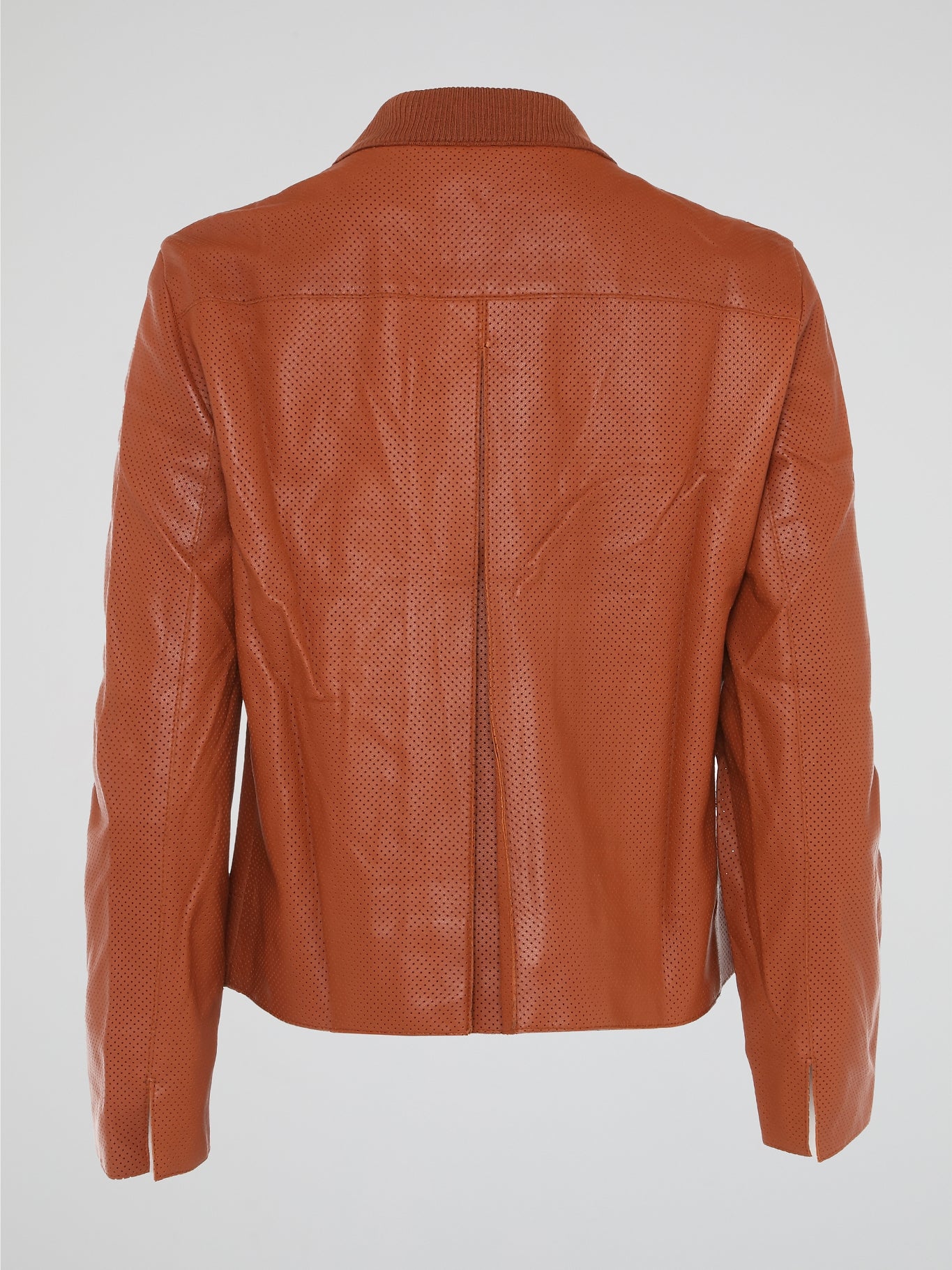 Step into the world of effortlessly cool style with our Orange Perforated Bomber Jacket by Akris Punto. Crafted with meticulous attention to detail, this vibrant piece seamlessly blends the classic bomber silhouette with modern perforated fabric for a unique twist. Whether you're exploring the city or hitting the dance floor, make a bold statement and exude confidence with this must-have jacket.