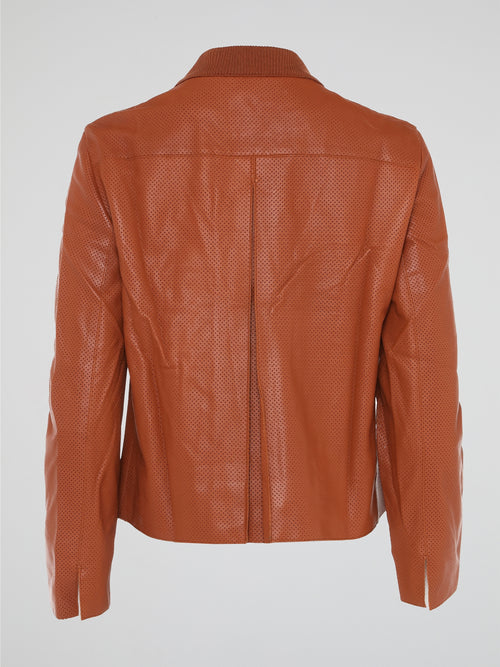 Step into the world of effortlessly cool style with our Orange Perforated Bomber Jacket by Akris Punto. Crafted with meticulous attention to detail, this vibrant piece seamlessly blends the classic bomber silhouette with modern perforated fabric for a unique twist. Whether you're exploring the city or hitting the dance floor, make a bold statement and exude confidence with this must-have jacket.
