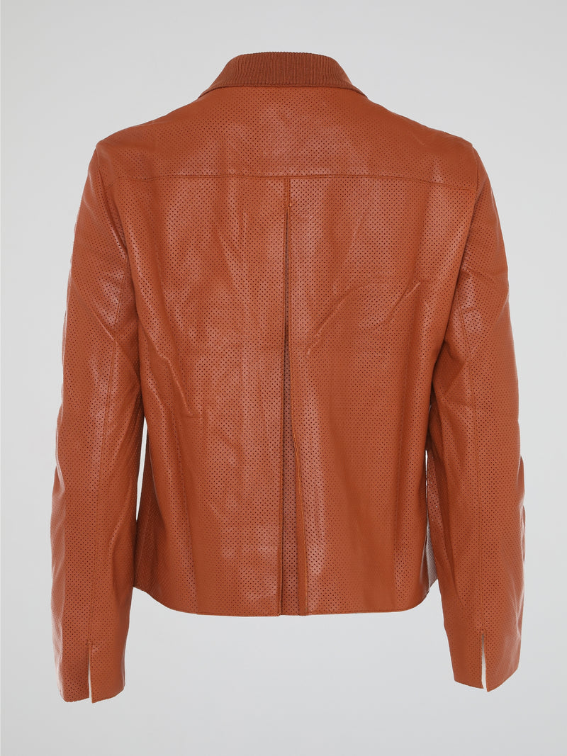 Step into the world of effortlessly cool style with our Orange Perforated Bomber Jacket by Akris Punto. Crafted with meticulous attention to detail, this vibrant piece seamlessly blends the classic bomber silhouette with modern perforated fabric for a unique twist. Whether you're exploring the city or hitting the dance floor, make a bold statement and exude confidence with this must-have jacket.