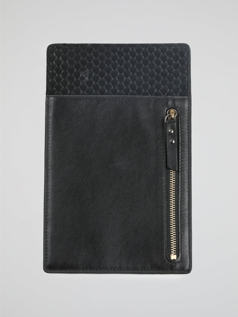 Travel in style and sophistication with the Black Leather Passport Holder by Roberto Cavalli. Crafted from luxurious, buttery-soft leather, this sleek accessory boasts an elegant black exterior adorned with the iconic Roberto Cavalli signature. With multiple card slots and a dedicated passport compartment, it effortlessly combines functionality with high-end fashion, making it the perfect companion for any globetrotting adventure.