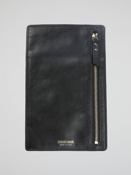 Travel in style and sophistication with the Black Leather Passport Holder by Roberto Cavalli. Crafted from luxurious, buttery-soft leather, this sleek accessory boasts an elegant black exterior adorned with the iconic Roberto Cavalli signature. With multiple card slots and a dedicated passport compartment, it effortlessly combines functionality with high-end fashion, making it the perfect companion for any globetrotting adventure.