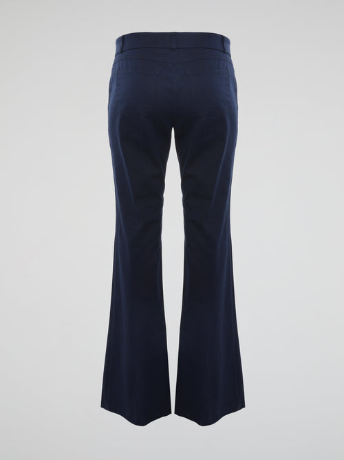 Step into the realm of timeless elegance with our Navy Flared Trousers by Roberto Cavalli. Crafted with impeccable precision, these trousers effortlessly blend classic sophistication with a modern twist. The flawless flared silhouette enhances your every move, making these trousers a captivating statement piece for any occasion.