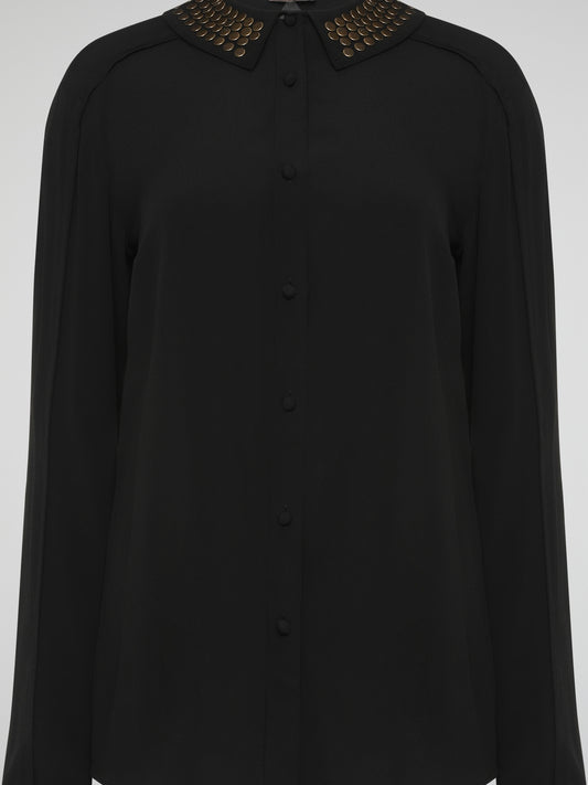 Step into the world of fierce elegance with the Black Studded Collar Blouse by Roberto Cavalli. This extraordinary piece effortlessly combines edgy appeal with timeless sophistication, making it a versatile addition to any wardrobe. With its luxurious fabric, daring studded collar, and impeccable craftsmanship, this blouse is a bold statement that exudes confidence and pushes boundaries.