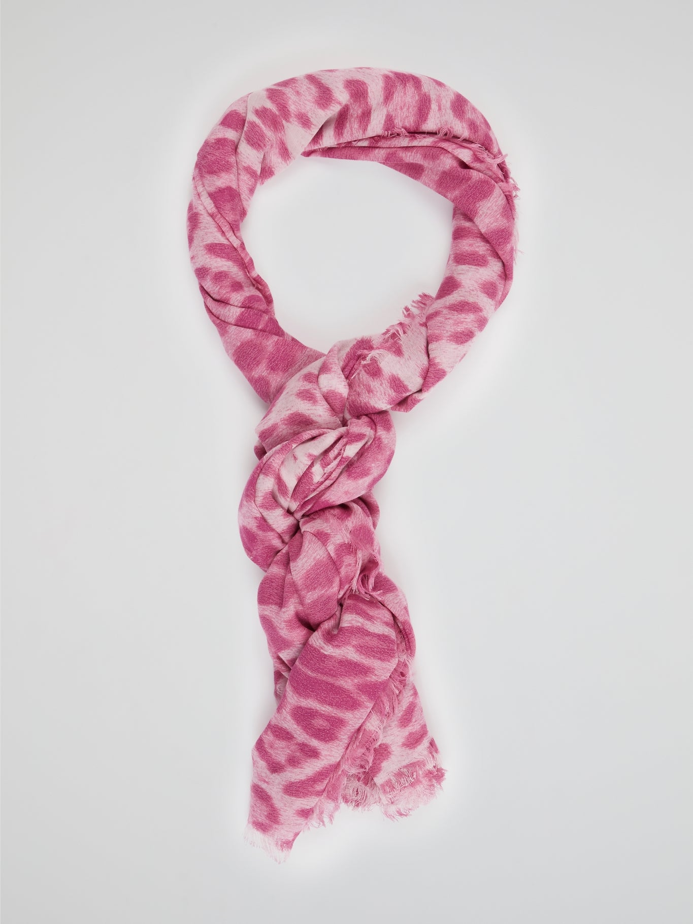 Wrap yourself in the wild elegance of this Pink Animal Print Scarf by Roberto Cavalli. The luxurious blend of soft fabric showcases a mesmerizing array of rosy hues, adorned with a fierce and playful animal motif. With each drape, let this statement accessory unleash your inner fashion safari, captivating attention wherever you go.
