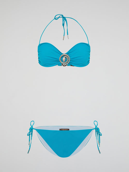 Dive into the depths of fashion with the Blue Snake Embellished Swimwear from legendary designer Roberto Cavalli. This luxurious and daring piece combines the grace of a siren with the boldness of a serpent, featuring a captivating blue snake pattern that will make heads turn at every poolside. Crafted with Cavalli's signature attention to detail and impeccable craftsmanship, unleash your inner goddess and conquer the waves in style.