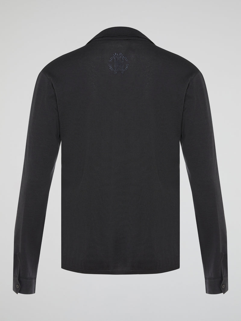 Elevate your style with the timeless elegance of our Black Long Sleeve Polo Shirt by Roberto Cavalli. Crafted with meticulous attention to detail, this wardrobe staple features a luxurious blend of comfort and sophistication. Whether you're headed to a casual brunch or a formal event, this Polo Shirt will effortlessly take you from day to night with its sleek design and iconic Cavalli logo.