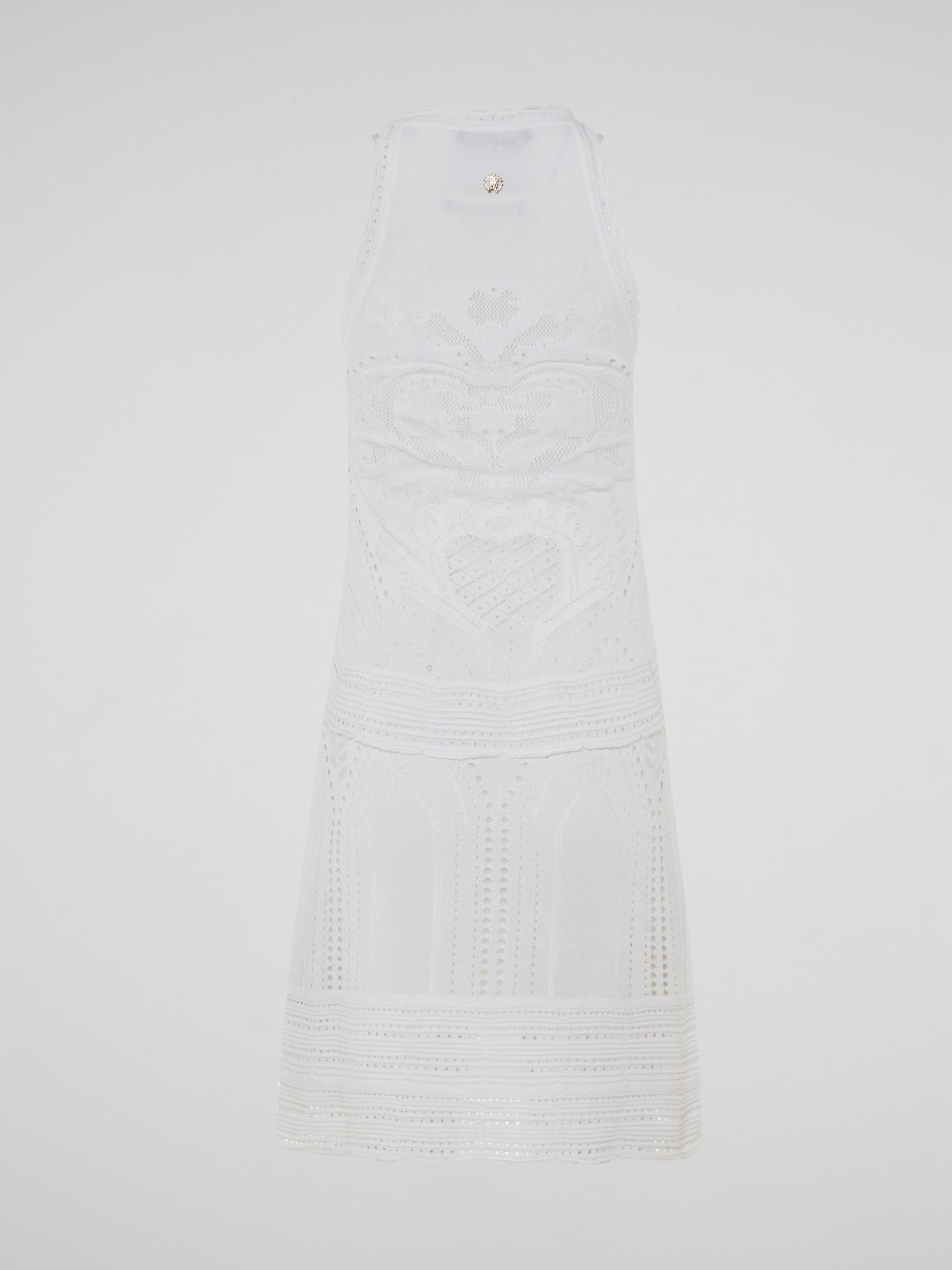 Dance into shimmering moonlit nights in the ethereal beauty of the White Knitted Sleeveless Dress by Roberto Cavalli. Crafted with meticulous artistry, this exquisite dress features delicate knitted patterns that seamlessly cascade down your curves, creating an enchanting silhouette. With its timeless elegance and romantic charm, this dress is a masterpiece that exudes pure grace and allure.