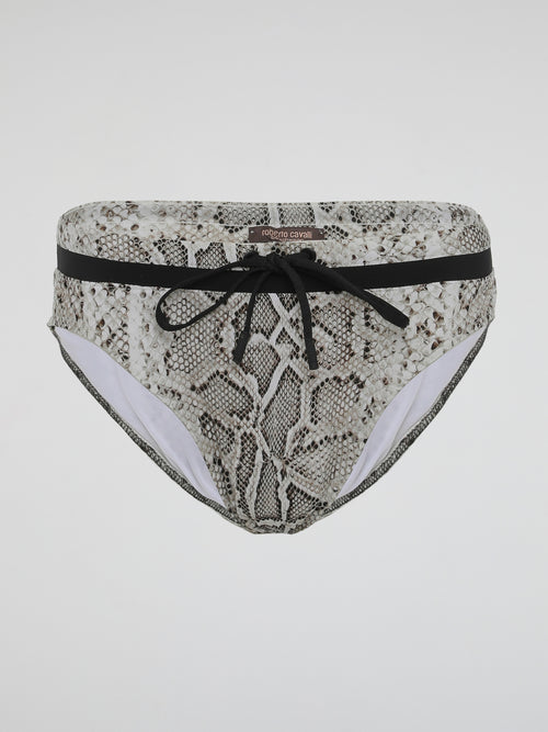 Dive into the wild side with our alluring Snake Print Swimwear by Roberto Cavalli. Unleashing the primal elegance of a slithering serpent, this collection embodies a sense of untamed adventure and confident sensuality. Crafted with luxurious fabrics and exquisitely tailored to accentuate your curves, our swimwear ensures you stand out from the crowd with a fierce fashion statement that is as captivating as the snake itself.