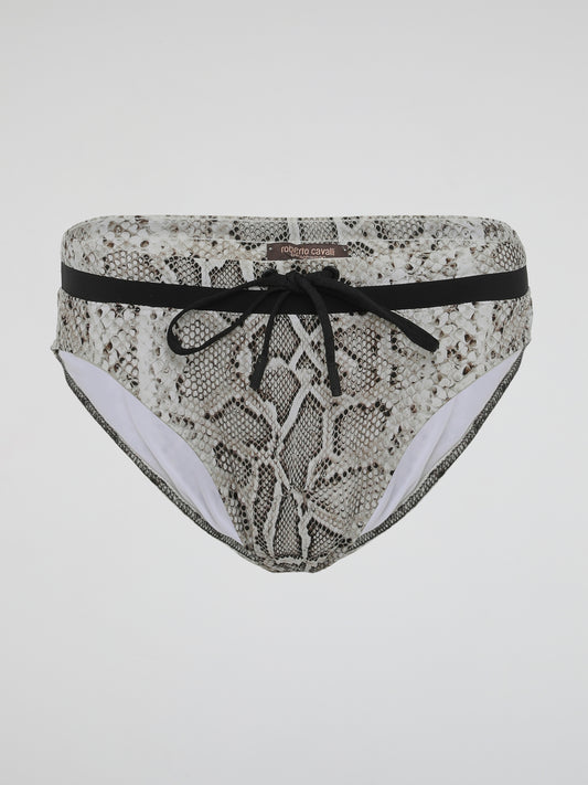 Dive into the wild side with our alluring Snake Print Swimwear by Roberto Cavalli. Unleashing the primal elegance of a slithering serpent, this collection embodies a sense of untamed adventure and confident sensuality. Crafted with luxurious fabrics and exquisitely tailored to accentuate your curves, our swimwear ensures you stand out from the crowd with a fierce fashion statement that is as captivating as the snake itself.