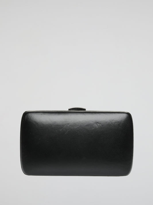 Introducing the Exquisite Embellished Leather Clutch by Roberto Cavalli - a true masterpiece that transcends the boundaries of style. Crafted with meticulous attention to detail, this clutch embodies the essence of timeless luxury. The stunning embellishments and supple leather make it an absolute must-have accessory for the fashion-forward individuals who dare to make a statement.