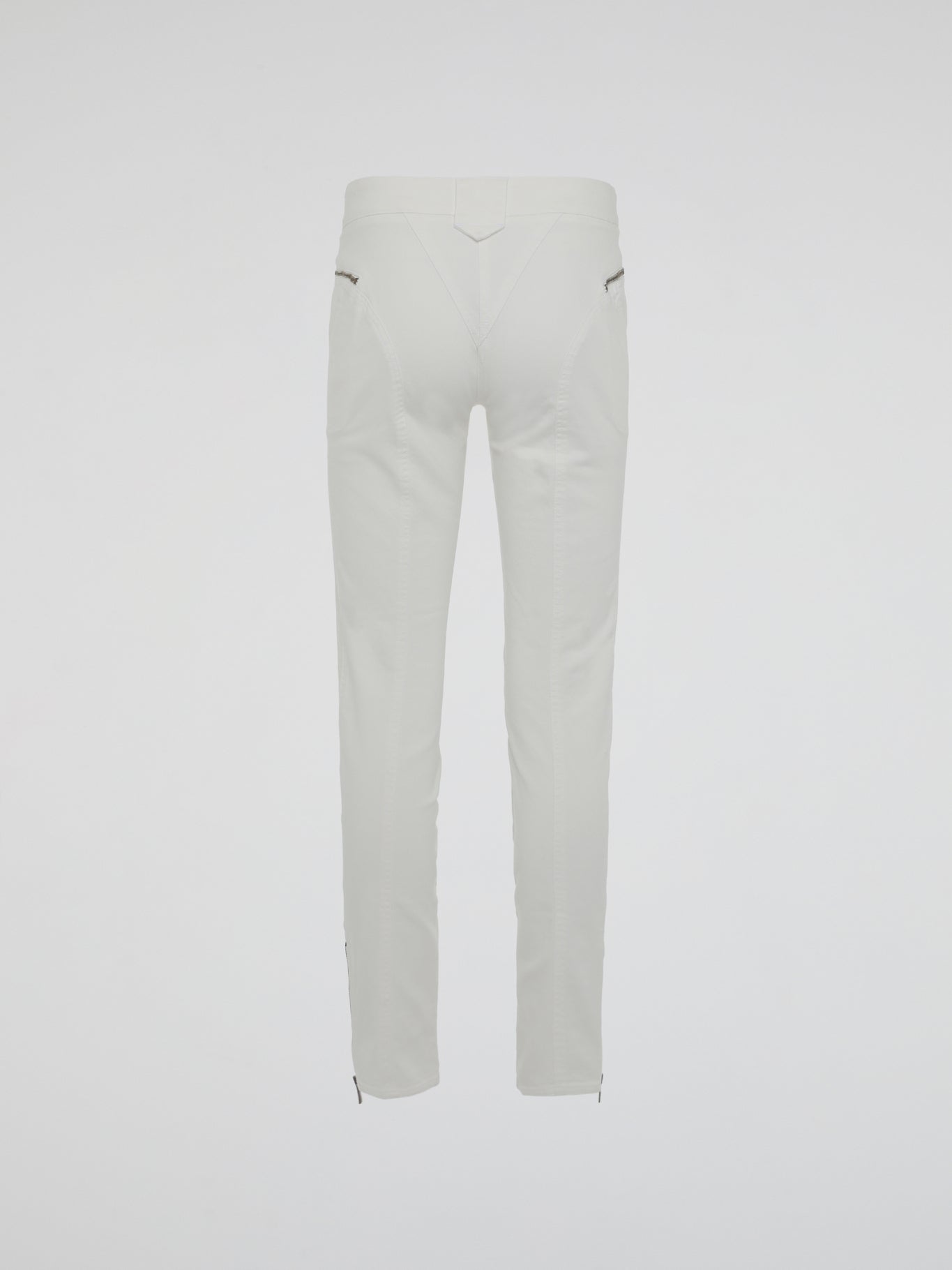 Introducing the epitome of style and sophistication - the White Zipper Detailed Trousers by Roberto Cavalli. These exquisite trousers blend modern minimalism with edgy details, boasting a sleek white hue that exudes elegance. The alluring zipper accents strategically placed throughout add a touch of rebellious charm, making these trousers a true fashion statement.