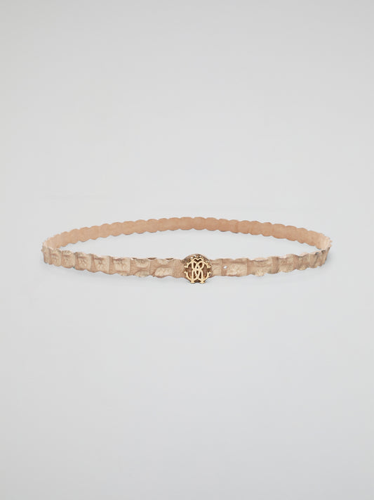 Elevate your everyday look with the timeless sophistication of the Beige Logo Buckle Belt from Roberto Cavalli. Crafted from luxurious leather, this accessory features a sleek and stylish logo buckle in a classic beige hue. Perfect for adding a touch of designer flair to any outfit, this belt is a must-have for fashion-forward individuals.