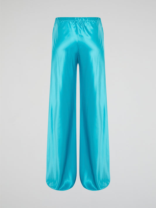 Step up your style game with these luxurious blue silk pants by Roberto Cavalli. The drawstring waist adds a casual and comfortable touch to the elegant silk fabric, making them perfect for any occasion. Stand out from the crowd and make a statement with these unique and eye-catching pants.