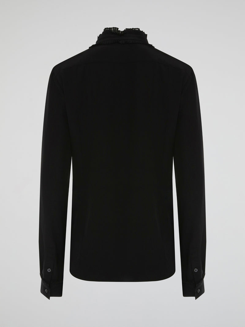 Step into the world of high fashion with this Roberto Cavalli Black Frill Detailed Blouse. The flowing silhouette is accentuated by intricate frill detailing, adding a touch of drama and elegance to any outfit. Whether paired with jeans for a casual chic look or with a skirt for a night out, this blouse is sure to turn heads wherever you go.