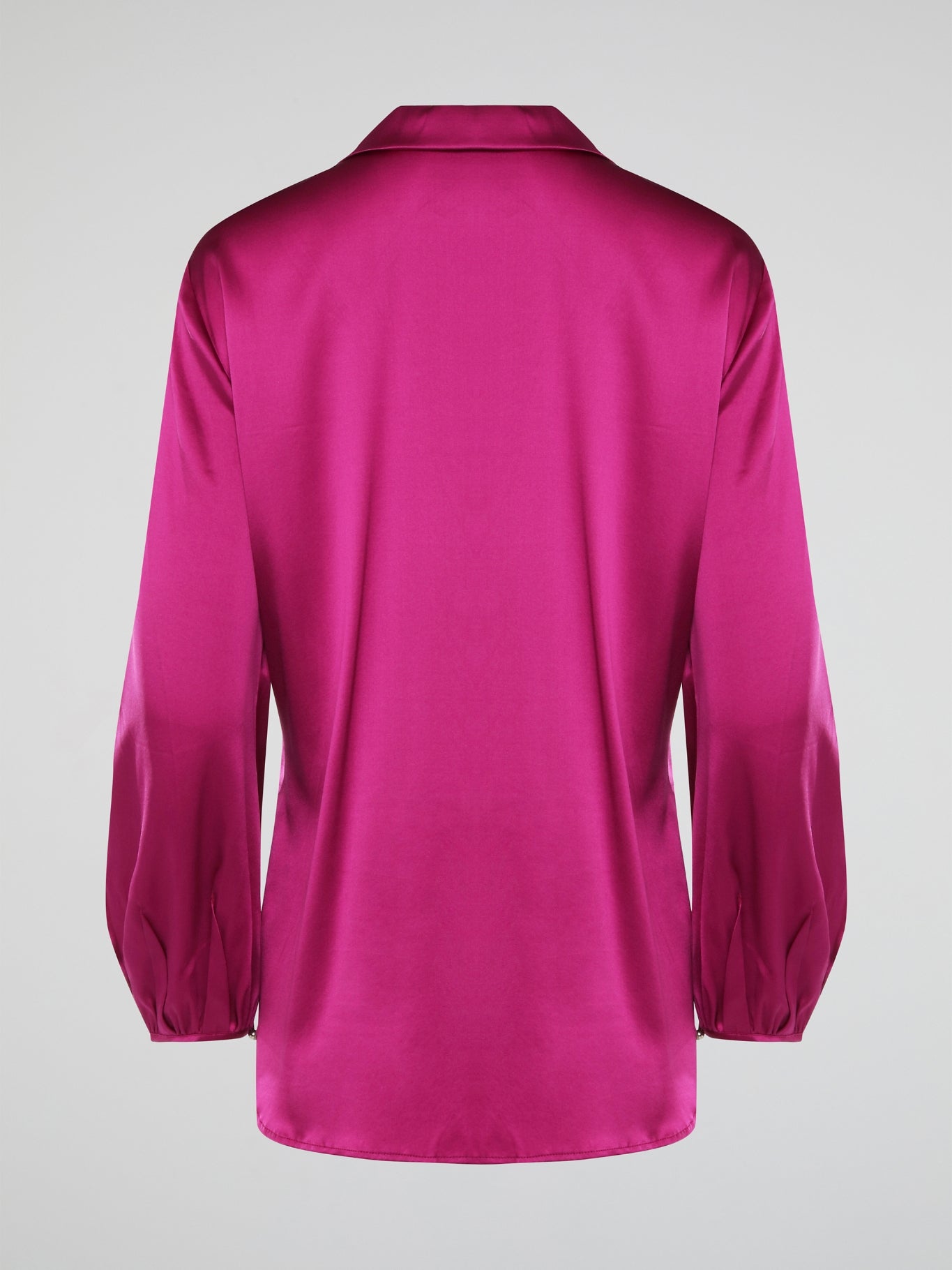 Elevate your wardrobe with this exquisite Pink Long Sleeve Silk Shirt by Roberto Cavalli. Crafted from luxurious silk fabric, this shirt drapes beautifully on the body, creating a sophisticated silhouette. The vibrant pink hue adds a pop of color to any outfit, making it the perfect statement piece for any occasion.