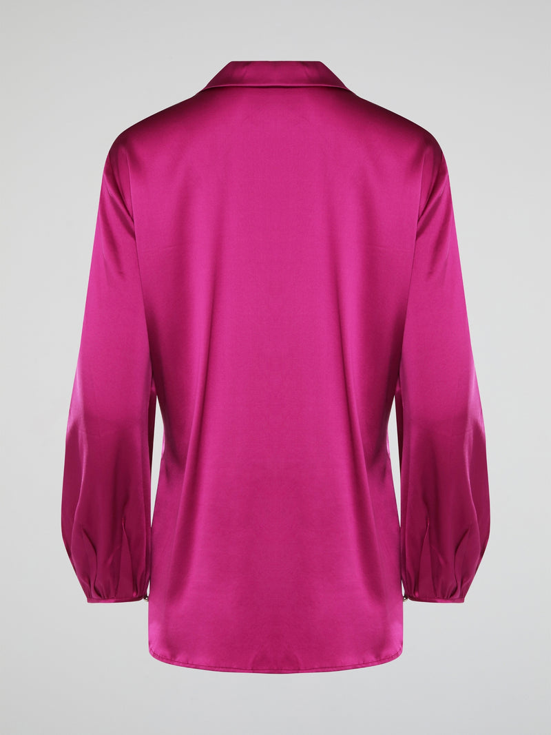 Elevate your wardrobe with this exquisite Pink Long Sleeve Silk Shirt by Roberto Cavalli. Crafted from luxurious silk fabric, this shirt drapes beautifully on the body, creating a sophisticated silhouette. The vibrant pink hue adds a pop of color to any outfit, making it the perfect statement piece for any occasion.