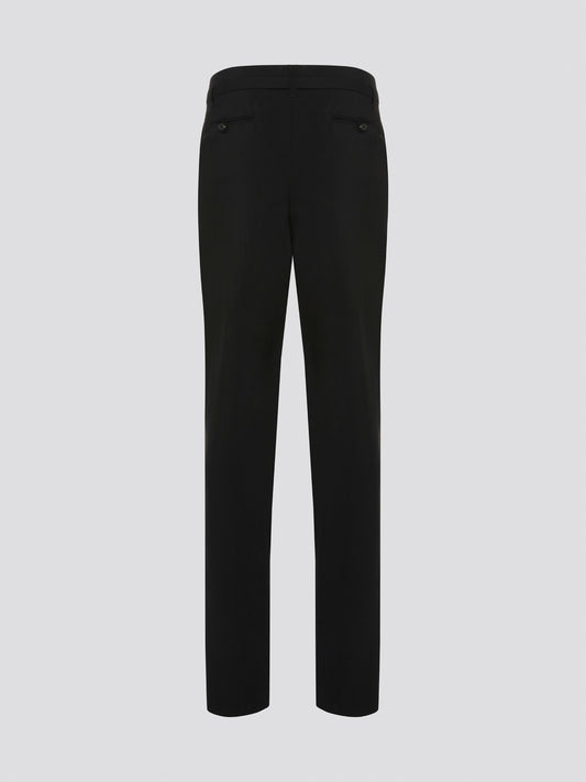 Step up your style game with these chic Black Belted Pleated Trousers by Roberto Cavalli, designed to make a statement. The flattering pleats and elegant belt detailing give these trousers a sophisticated edge, perfect for any fashion-forward individual. Whether worn to the office or a night out on the town, these trousers are sure to turn heads and leave a lasting impression.