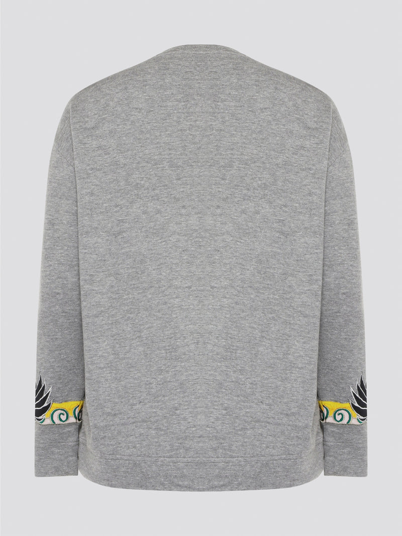 Elevate your casual wardrobe with this effortlessly chic Grey Embroidered Sweatshirt from Roberto Cavalli. Crafted with intricate floral embroidery, this sweatshirt adds a touch of luxury to your everyday look. Pair it with jeans for a stylish and comfortable outfit that will turn heads wherever you go.