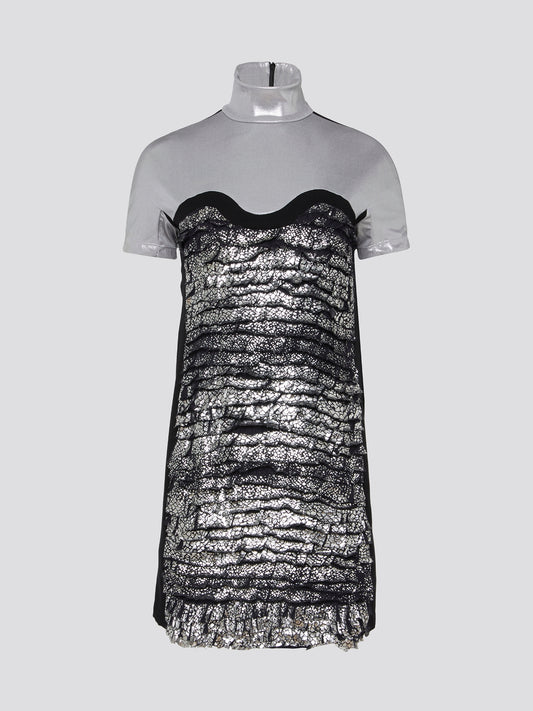 Shimmer and shine in the spotlight with our Metallic Turtleneck Mini Dress by Versus Versace. This show-stopping piece combines edgy fashion with a touch of glamour, perfect for stepping out in style. With its sleek turtleneck and eye-catching metallic finish, you'll be sure to turn heads wherever you go.