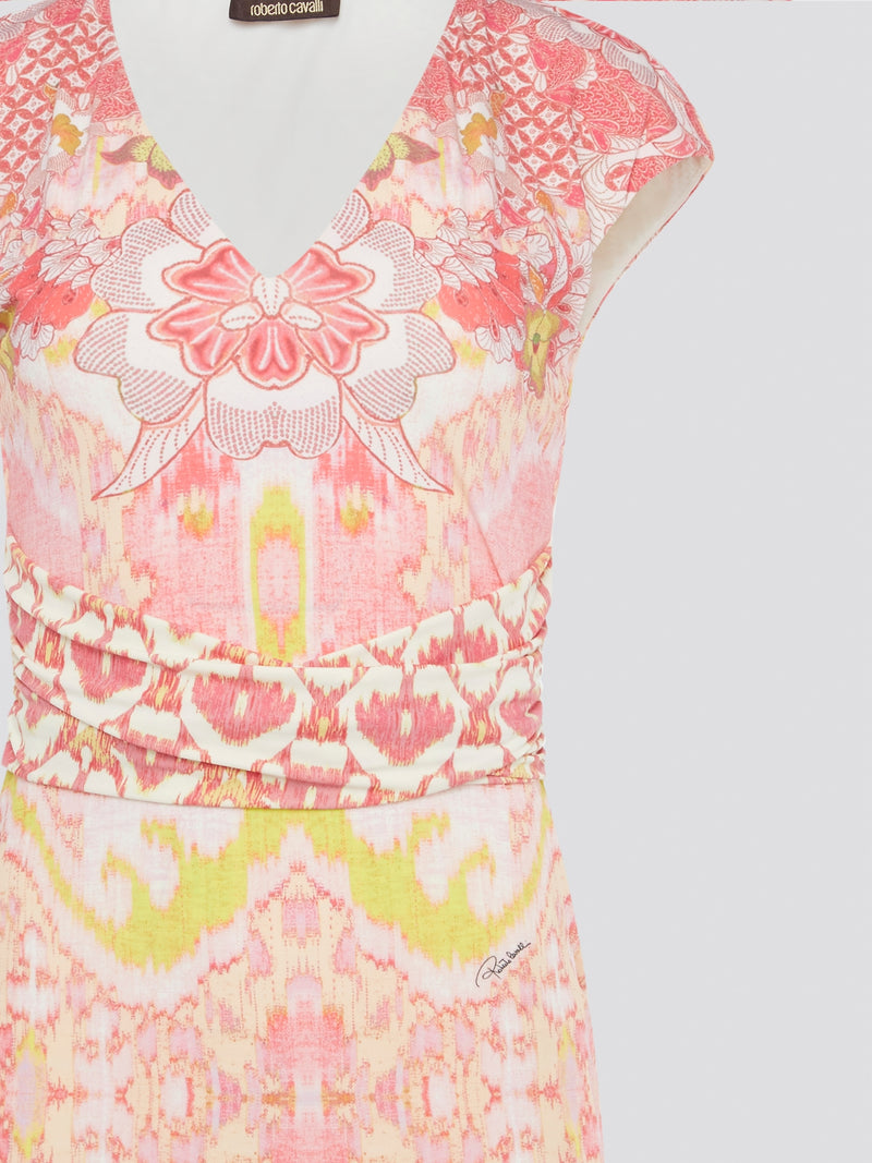 Transform any occasion into a fashion moment with this Pink Printed Cap Sleeve Dress by Roberto Cavalli. The vibrant hues and striking print instantly command attention, while the flattering cap sleeves and fitted silhouette elevate your feminine allure. Embrace your inner style icon and make a statement in this bold and beautiful designer dress.