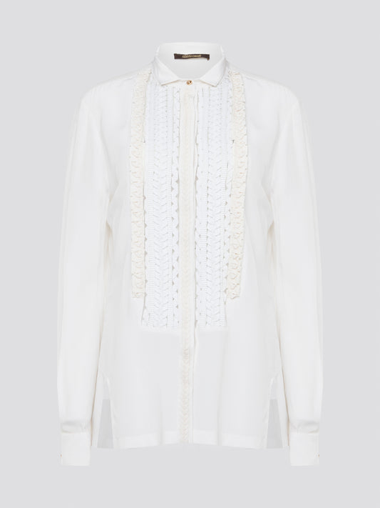 Elevate your wardrobe with this stunning Roberto Cavalli white detailed long sleeve shirt. Crafted with exquisite attention to detail, this shirt features intricate embroidery and embellishments that exude luxury and elegance. Perfect for adding a touch of sophistication to any ensemble, this statement piece is sure to turn heads wherever you go.