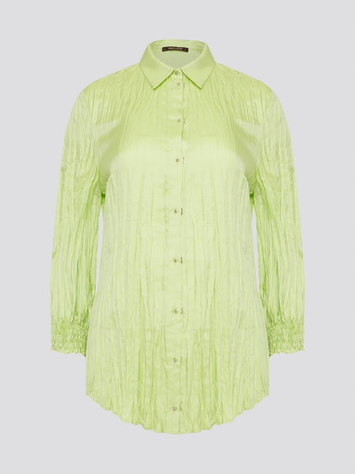 Step into the wild side with this striking green crinkled shirt from Roberto Cavalli. The vibrant hue and unique texture of the fabric will ensure you stand out from the crowd wherever you go. Embrace your fearless fashion sense and unleash your inner style icon with this must-have statement piece.