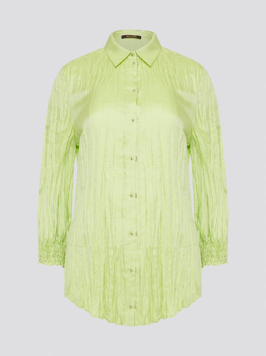 Step into the wild side with this striking green crinkled shirt from Roberto Cavalli. The vibrant hue and unique texture of the fabric will ensure you stand out from the crowd wherever you go. Embrace your fearless fashion sense and unleash your inner style icon with this must-have statement piece.