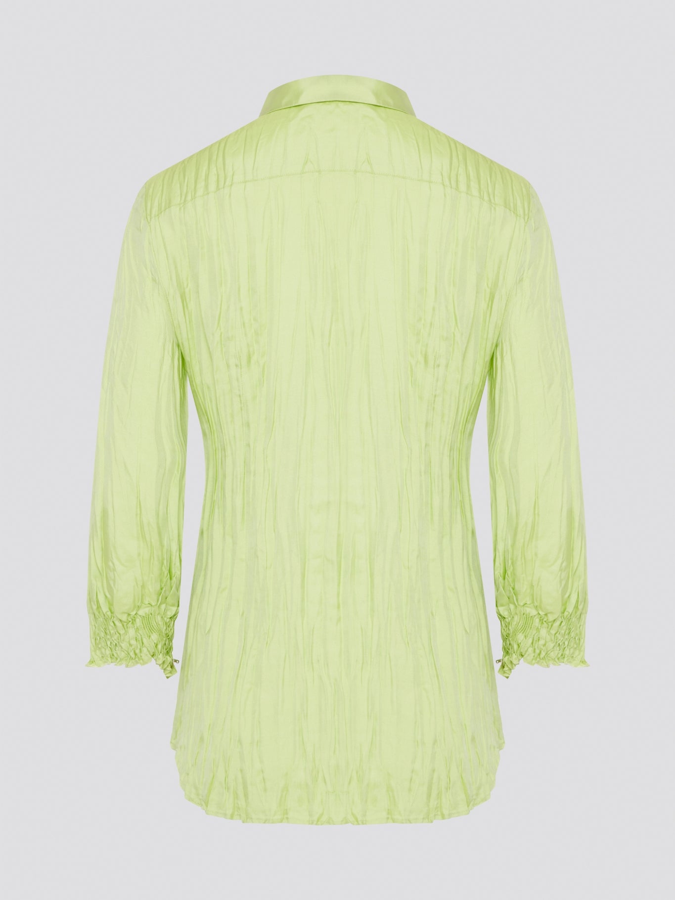 Step into the wild side with this striking green crinkled shirt from Roberto Cavalli. The vibrant hue and unique texture of the fabric will ensure you stand out from the crowd wherever you go. Embrace your fearless fashion sense and unleash your inner style icon with this must-have statement piece.