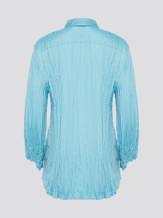 Elevate your wardrobe with the stunning Blue Crinkled Shirt from Roberto Cavalli. Crafted with meticulous attention to detail, this shirt features a unique crinkled texture that adds depth and dimension to any outfit. Whether you're dressing it up for a night out or keeping it casual for a day at the office, this shirt is sure to turn heads and make a statement.