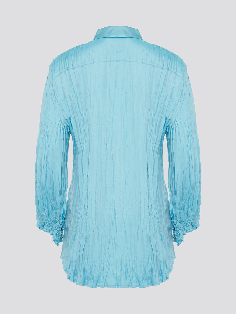 Elevate your wardrobe with the stunning Blue Crinkled Shirt from Roberto Cavalli. Crafted with meticulous attention to detail, this shirt features a unique crinkled texture that adds depth and dimension to any outfit. Whether you're dressing it up for a night out or keeping it casual for a day at the office, this shirt is sure to turn heads and make a statement.
