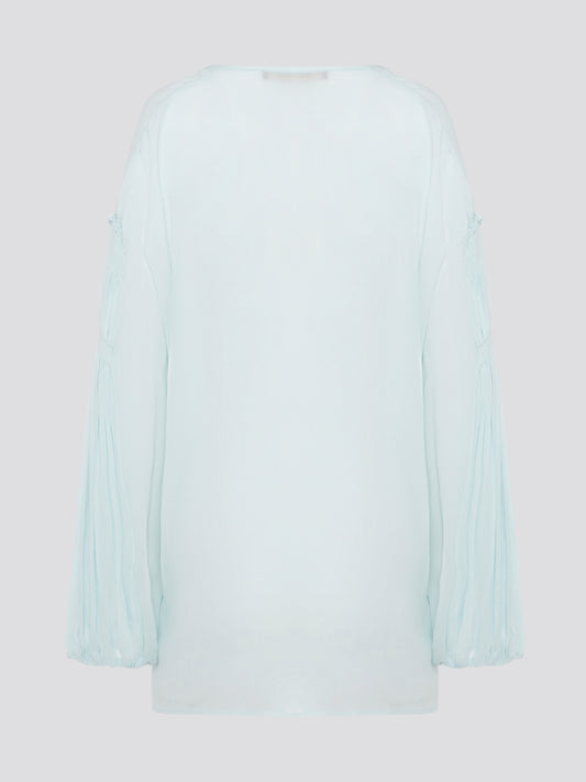 Step up your fashion game with this stunning Mint Green Tie Front Blouse by Roberto Cavalli. The delicate mint green hue and flattering tie front detail will make you stand out in any crowd. Pair it with your favorite jeans for a casual daytime look or dress it up with some sleek trousers for a night out on the town.