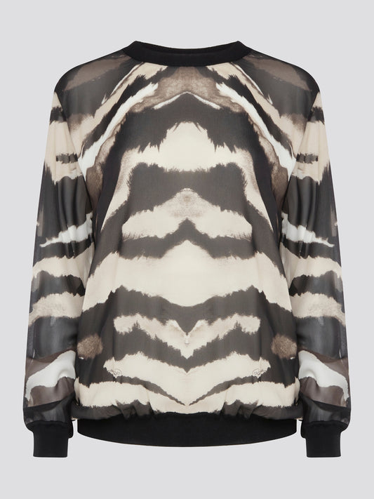 Make a fierce fashion statement with the Roberto Cavalli Zebra Print Sweatshirt, featuring a bold and eye-catching zebra print design. Crafted from premium materials, this sweatshirt offers both style and comfort for all-day wear. Elevate your street style with this standout piece that is sure to turn heads wherever you go.