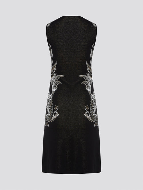 Elevate your wardrobe with the exquisite Knitted Bodycon Dress by Roberto Cavalli. Crafted with precision and care, this dress features intricate knitted details that hug your curves in all the right places. Make a statement at any event with this luxurious and unique piece that exudes elegance and style.