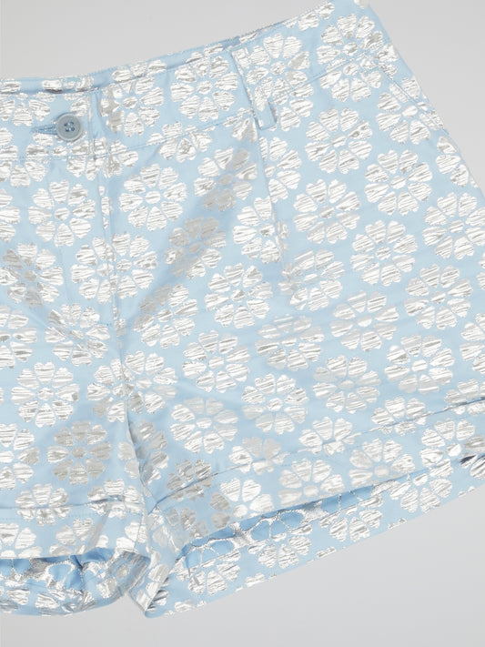 Transport yourself to a whimsical garden with these Blue Floral Print Shorts by Parosh. Made from luxurious fabric, these shorts feature a vibrant blue hue adorned with intricate floral designs for a statement-making look. Perfect for exploring the city or lounging in the sun, these shorts are a must-have addition to your wardrobe.