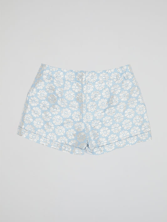 Transport yourself to a whimsical garden with these Blue Floral Print Shorts by Parosh. Made from luxurious fabric, these shorts feature a vibrant blue hue adorned with intricate floral designs for a statement-making look. Perfect for exploring the city or lounging in the sun, these shorts are a must-have addition to your wardrobe.
