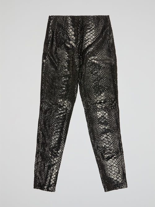 Unleash your wild side with our Black Reptilian Leather PantsIceberg, designed to make a bold statement. Crafted from high-quality faux leather with a sleek reptile texture, these pants are perfect for standing out in a crowd. Embrace your inner rockstar and take your style to the next level with these edgy and stylish pants.
