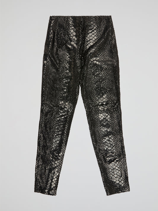 Unleash your wild side with our Black Reptilian Leather PantsIceberg, designed to make a bold statement. Crafted from high-quality faux leather with a sleek reptile texture, these pants are perfect for standing out in a crowd. Embrace your inner rockstar and take your style to the next level with these edgy and stylish pants.