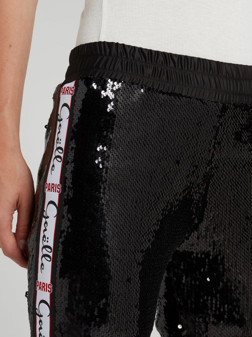 Черные брюки на резинке с пайетками